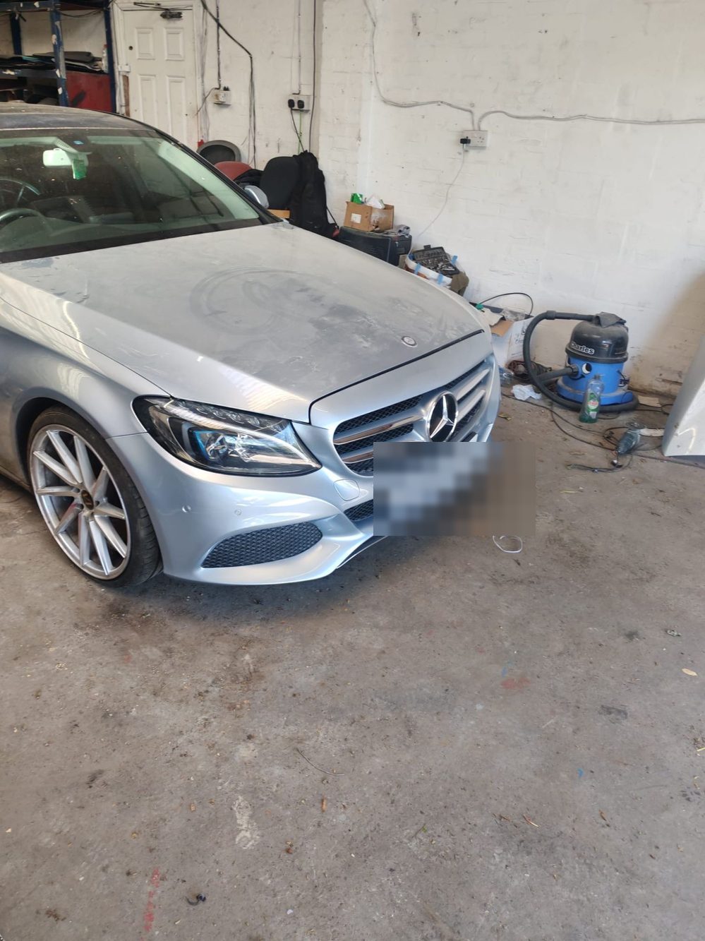 The same Mercedes-Benz C-Class with the front end rebuilt and resprayed