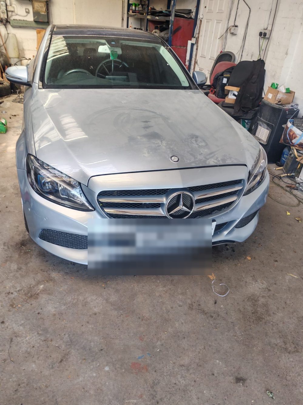 The same Mercedes-Benz C-Class with the front end rebuilt and resprayed