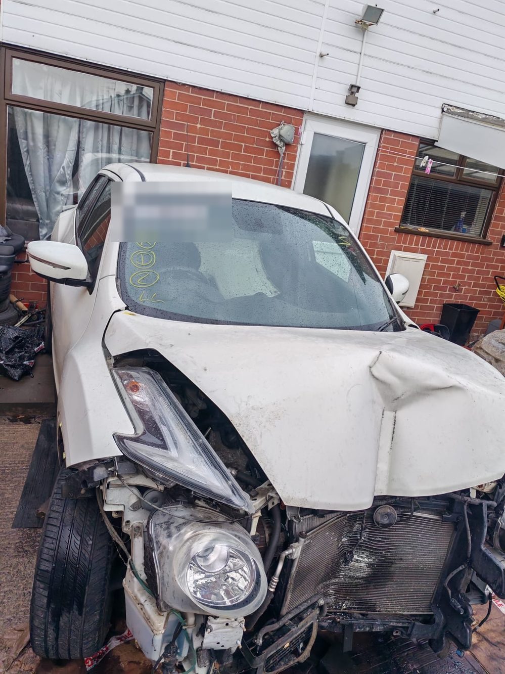 Nissan Juke with front-end collision damage before repair at Wiluc Motors
